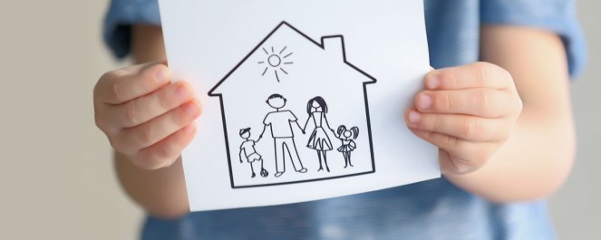 bigstock-Child-holding-drawing-of-house-170357882-1180x472